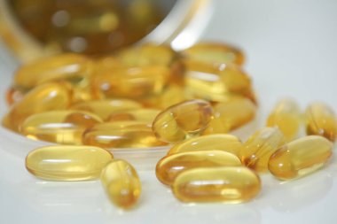 Capsule omega 6 and 3 in yellow transparent color.