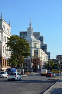 Buildings and buildings, interesting streets, trees - landscape design in the center of the city of Dnipro, near the Dnipropetrovsk Academic Opera and Ballet Theatre, Ukraine.