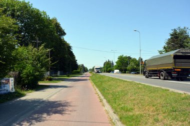 Beautiful and unusual central streets of the city of Wyszkw, Poland with their houses, apartments, nature, trees, long streets, crossroads.