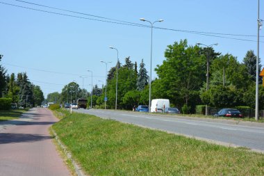 Beautiful and unusual central streets of the city of Wyszkw, Poland with their houses, apartments, nature, trees, long streets, crossroads.