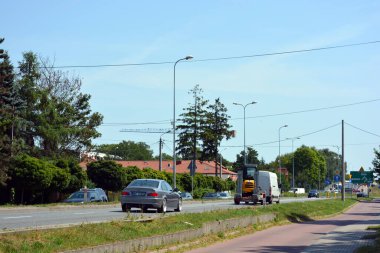 Beautiful and unusual central streets of the city of Wyszkw, Poland with their houses, apartments, nature, trees, long streets, crossroads.