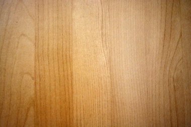 Yellow, light background made of natural wood, opened with building varnish. Unimaginable wooden boards with their structure, texture and pattern. It looks very stylish.