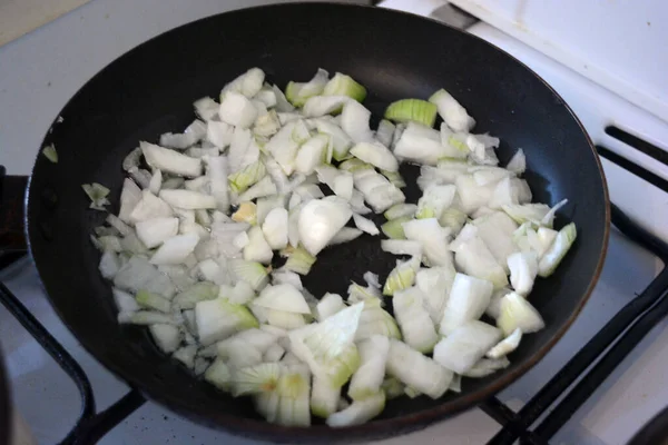 Cooking Healthy Food Onion Cut Cubes Fried Black Kitchen Pan — Zdjęcie stockowe