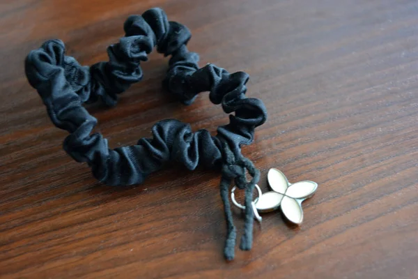 Women Jewelry Black Hair Band Lies Brown Wooden Table — 图库照片