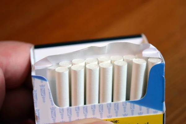 Pack White Thin Cigarettes Lying Yellow Wooden Table — Fotografia de Stock