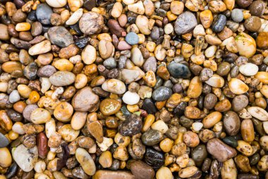 An image flat lay or top view abstract a get wet the rock many colors for background stone with space for text and use wallpaper.