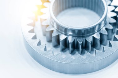 Close-up scene of assembly gear pump parts with lighting effect . The abstract scene of gear part in the mechanical parts manufacturing system.
