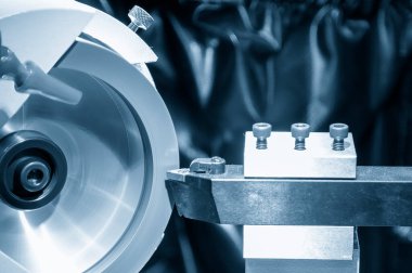 The lathe tool regrind process with abrasive stone wheel. The tool regrinding process for turning machine.