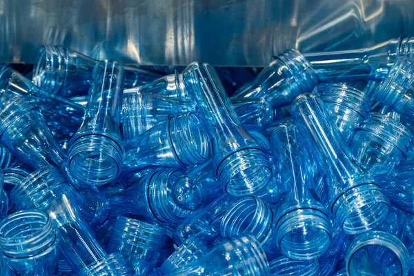 The close up scene of group of preform shape of PET bottle products. The raw material for plastic bottle manufacturing process.