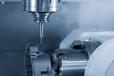 The  4-axis  machining center cutting the aluminum gear housing parts. The hi-precision automotive parts manufacturing process by multi-axis CNC milling machine.