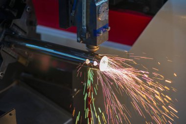 The fiber laser cutting machine cutting  machine cut the stainless steel tube. The hi-technology sheet metal manufacturing process by laser cutting machine. 