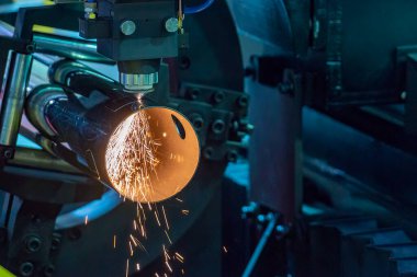 The fiber laser cutting machine cutting  machine cut the stainless steel tube. The hi-technology sheet metal manufacturing process by laser cutting machine. 