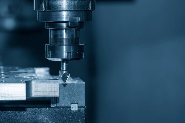 The chamfering process with the metal plate parts on NC milling machine.  The shop floor milling operation by milling machine