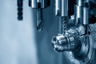 The multi-tasking CNC lathe machine swiss type tapping the brass shaft parts. The high technology metal working with CNC turning machine.