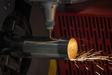 The fiber laser cutting machine cutting  machine cut the stainless steel tube. The hi-technology sheet metal manufacturing process by laser cutting machine. 