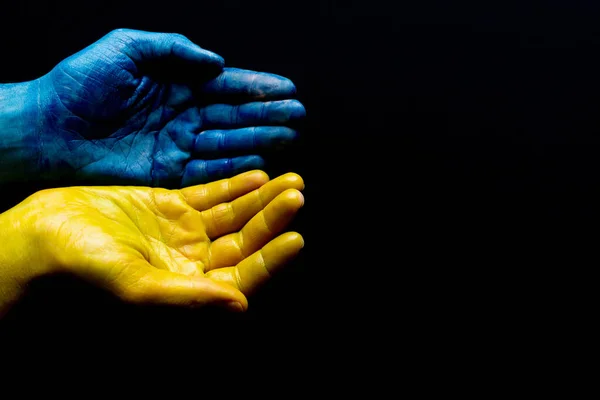 Mains ukrainiennes bleues et jaunes isolées symboliques Photos De Stock Libres De Droits