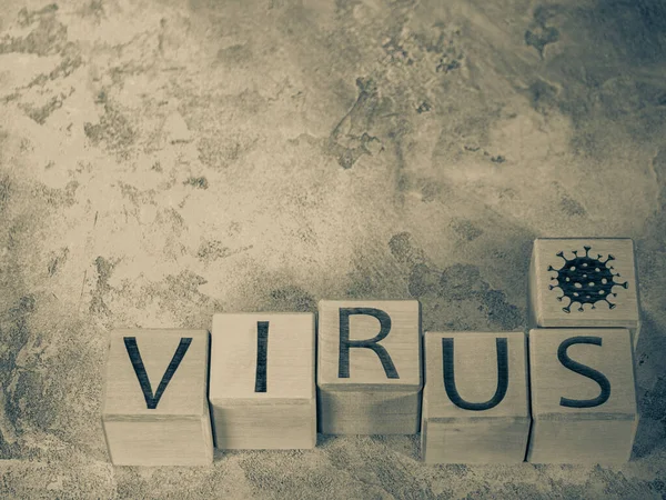 Covid-19 pandemic or endemic symbol text on wooden cubes