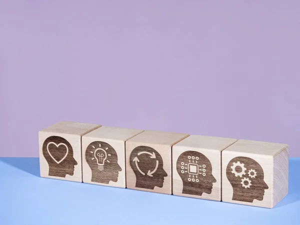 Power skills symbols on wooden cubes as management evolution concept