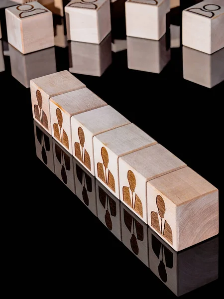 Customer retention concept and attracting potential customers on wooden cubes