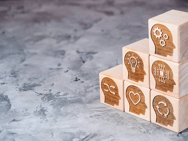 Soft power skills symbols on wooden cubes as a concept of new skill, reskilling and upskilling