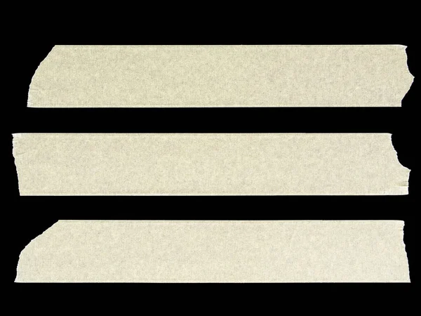 Cross of pieces of masking tape isolated on a black background