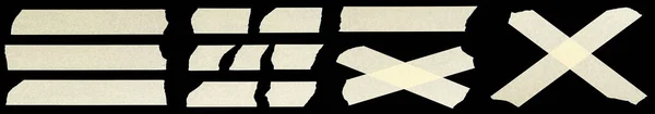 黒い背景に隔離されたマスキングテープの破片のクロス — ストック写真