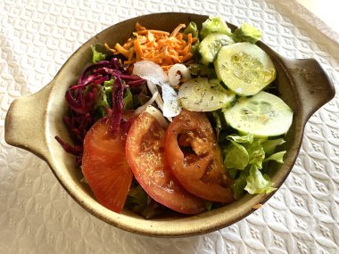 Assorted fresh vegetables salad. Raw vegetables (tomatoes, beetroot, zucchini, carrots, lettuce) ingredients for snack, salad or soup.