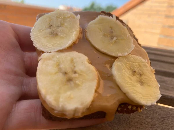 Healthy Snack Made Banana Slices Peanut Butter Grey Background — ストック写真