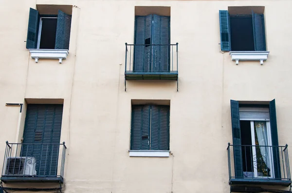 Vintage windows and small balconies on facade of old building in the centre of Madrid. Spain. 2022
