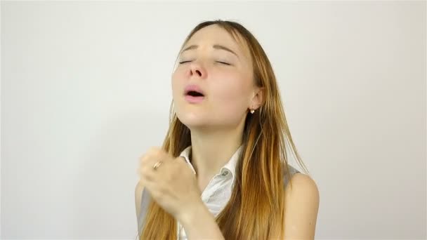 Beautiful young woman sneezing into a handkerchief — Video Stock