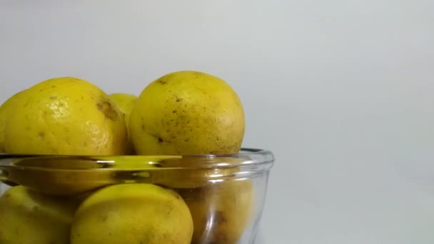 Concept Spinning Bowl Full Yellowish Citrus White Background Left Side — Stockvideo