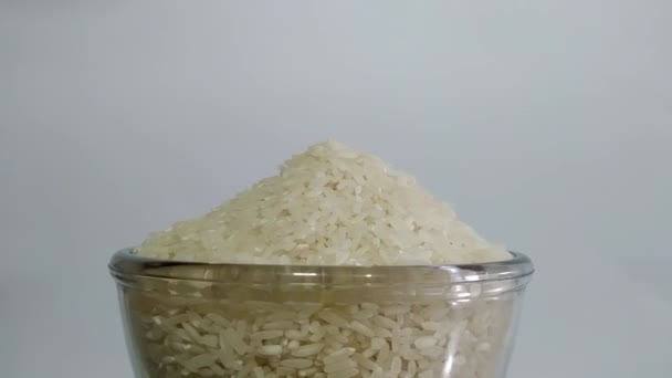 Concept Spinning Bowl Full Grain Rice White Background Center Screen — ストック動画