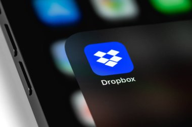 Dropbox mobile icon app on screen smartphone iPhone. Dropbox is file hosting company Dropbox Inc. Moscow, Russia - August 11, 2021 clipart