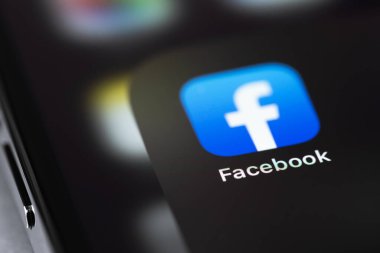 Facebook icon mobile app on screen smartphone iPhone macro. Facebook is largest and most popular social networking site in the world. Moscow, Russia - July 28, 2021