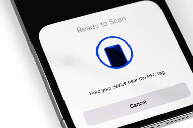 NFC scanner on screen smartphone iPhone. Apple is a multinational technology company. Moscow, Russia -  July 17, 2021