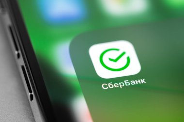 Sberbank (Sber) icon mobile app on screen smartphone iPhone closeup. Sberbank is the largest transnational, universal bank in Russia, Central and Eastern Europe. Moscow, Russia -  July 27, 2021
