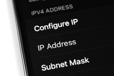 smartphone iPhone with Settings, IPV4 address Configure IP, IP Address on screen closeup. Apple is a multinational technology company. Moscow, Russia - August 16, 2021