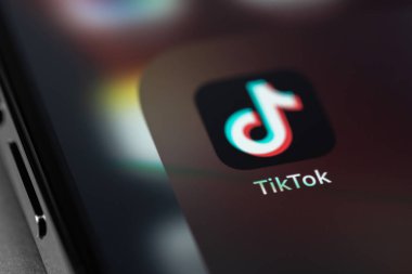 TikTok icon mobile app on screen smartphone iPhone closeup. TikTok is app to create and share videos. Moscow, Russia -  July 27, 2021