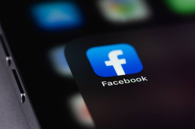 Facebook mobile icon app on screen smartphone iPhone closeup macro. Facebook is largest and most popular social networking site in the world. Moscow, Russia - October 5, 2021