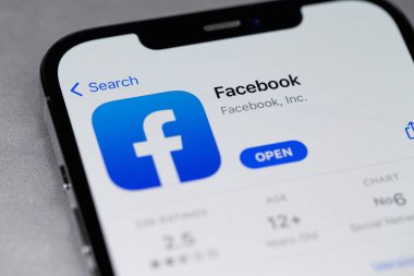 Facebook mobile icon app on screen smartphone iPhone. Facebook is largest and most popular social networking site in the world. Moscow, Russia - October 5, 2021