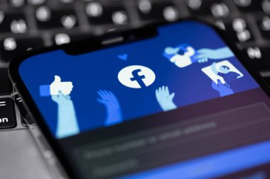 Facebook start page in mobile app on screen smartphone iPhone. Facebook is largest and most popular social networking site in the world. Moscow, Russia - October 5, 2021
