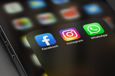 Facebook, Instagram, WhatsApp - social media icons messengers apps on screen smartphone iPhone. Moscow, Russia - October 5, 2021