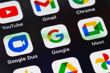 Google services (Google Search, YouTube, Gmail, Chrome, Google Duo, Google Meet, Podcasts, Drive, Photos) icons apps on screen smartphone iPhone closeup. Google is the biggest Internet search engine in the world. Moscow, Russia - August 12, 2021