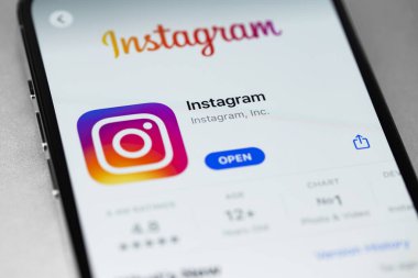 Instagram mobile app with logo on screen smartphone iPhone. Instagram is a photo-sharing app for smartphones. Moscow, Russia - October 5, 2021