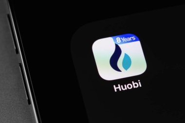 Huobi mobile app on screen smartphone with bitcoin. Huobi - one of the largest cryptocurrency exchange on the market. Moscow, Russia - October 14, 2021