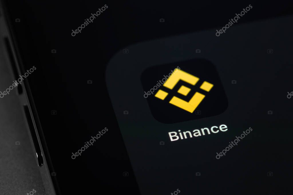 Binance mobile app on screen smartphone. Binance - one of the largest cryptocurrency exchange on the market. Moscow, Russia - October 14, 2021