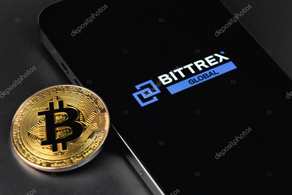 Bittrex Global logo cryptocurrency exchange on screen smartphone with bitcoin. Moscow, Russia - October 14, 2021