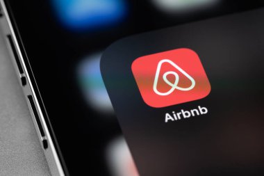 Airbnb mobile icon app on screen smartphone closeup. Airbnb is an online marketplace and hospitality service, enabling people to lease or rent short-term lodging. Moscow, Russia - October 14, 2021
