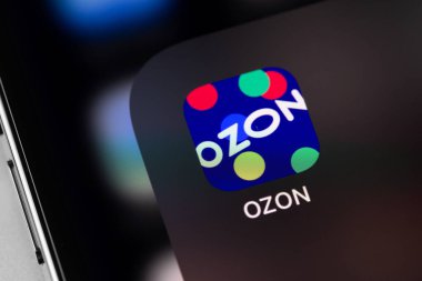 OZON mobile app for online shopping on screen smartphone closeup. Wildberries - russian marketplace, online stores, shopping in Russia. Moscow, Russia - October 14, 202