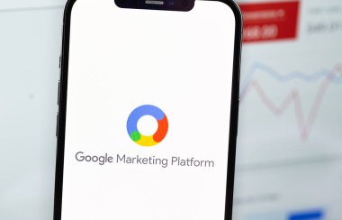 Google Marketing Platform logo on screen smartphone  and notebook background closeup. Google Ads is a service of contextual, basically, search advertising from Google. Moscow, Russia - January 17, 2022